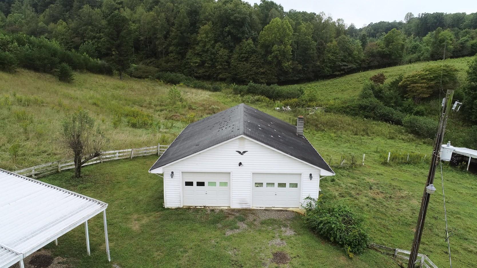 5560 Elamsville Road Stuart, VA 24171 - Photo 57 of 80 a view of house with backyard and garden