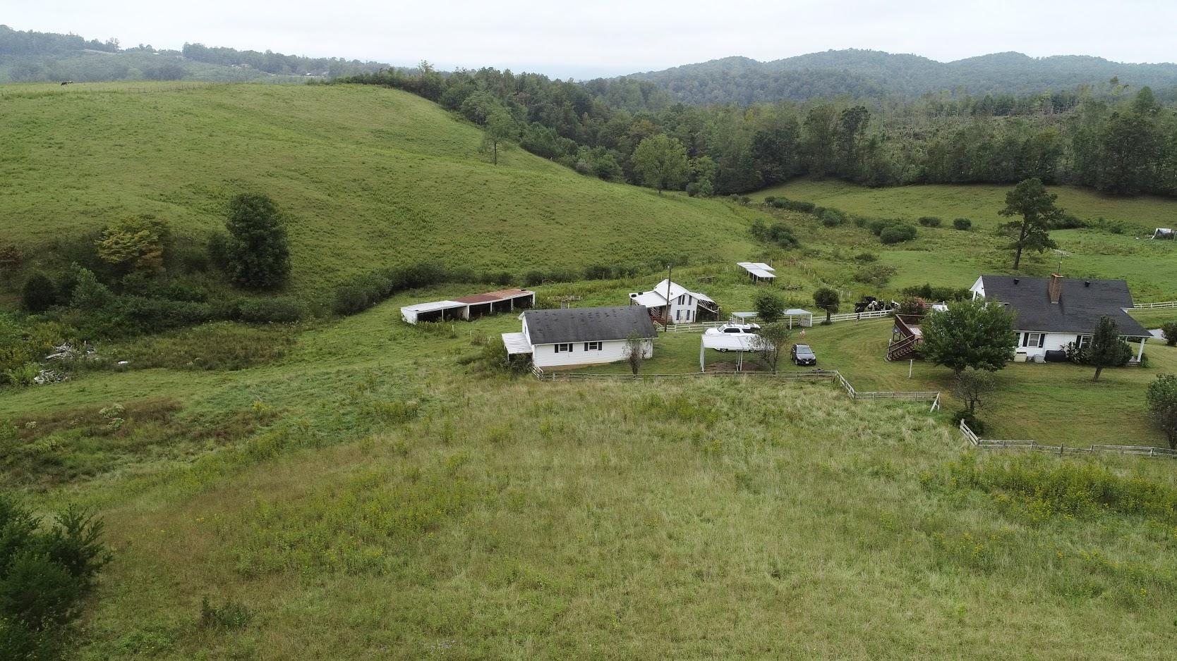 5560 Elamsville Road Stuart, VA 24171 - Photo 58 of 80 a view of a lake with a mountain in the back