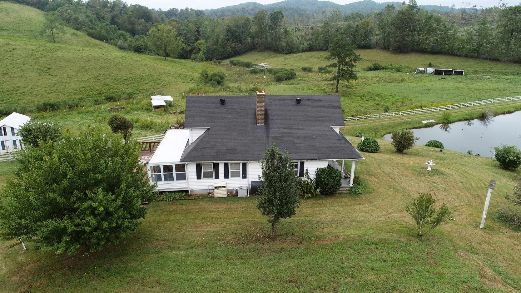 5560 Elamsville Road Stuart, VA 24171 - Photo 70 of 80 an aerial view of a house with a yard
