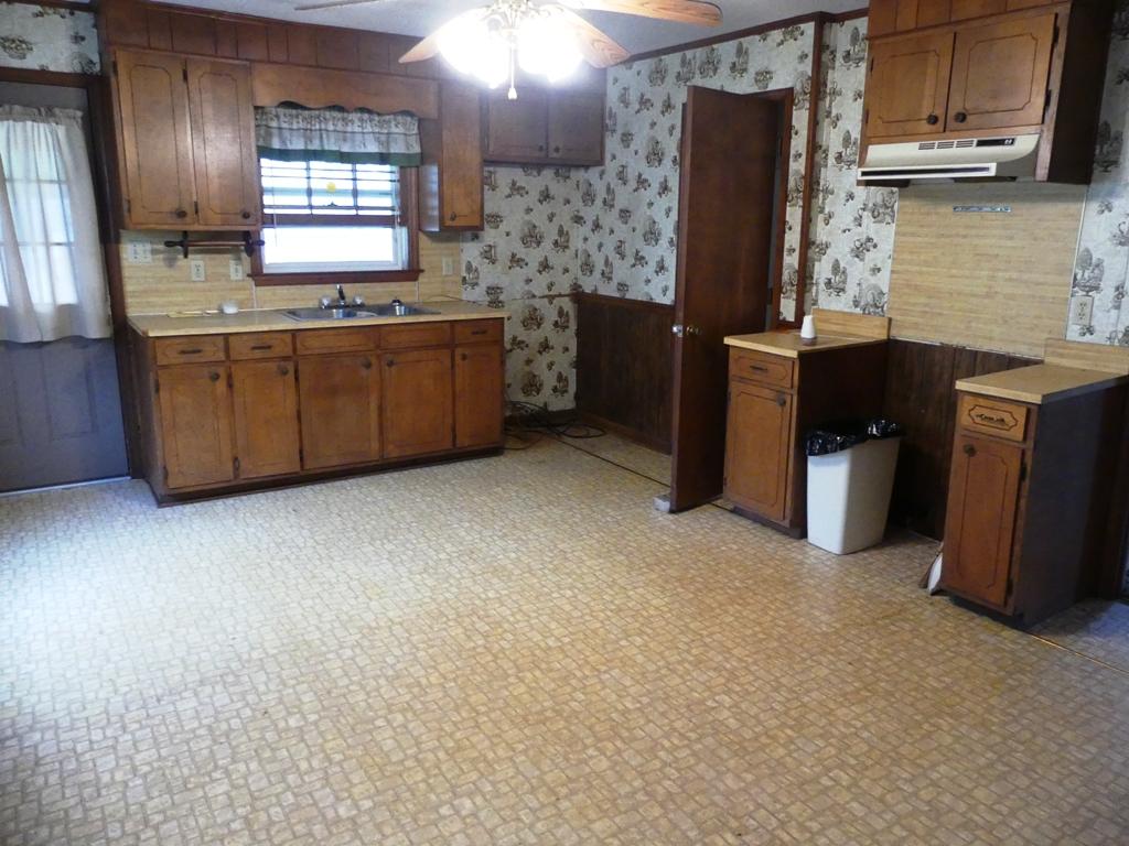 5560 Elamsville Road Stuart, VA 24171 - Photo 10 of 80 a kitchen with stainless steel appliances a sink and a refrigerator