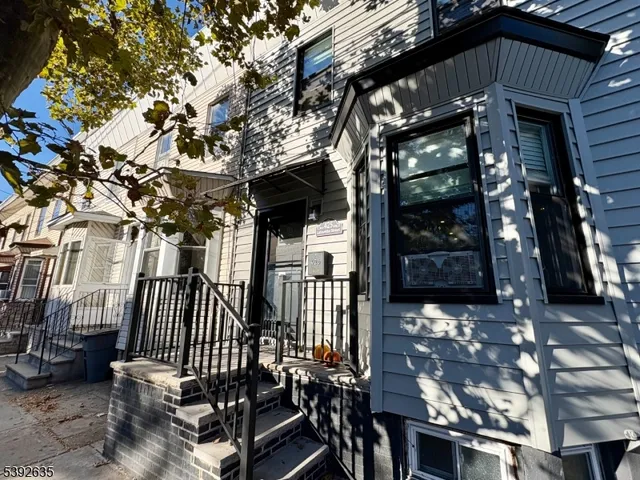 a view of a house with a bench in balcony