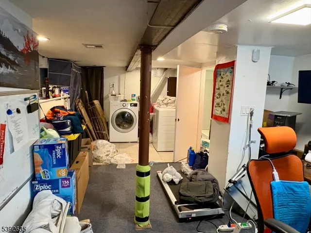 a room with furniture and gym equipment