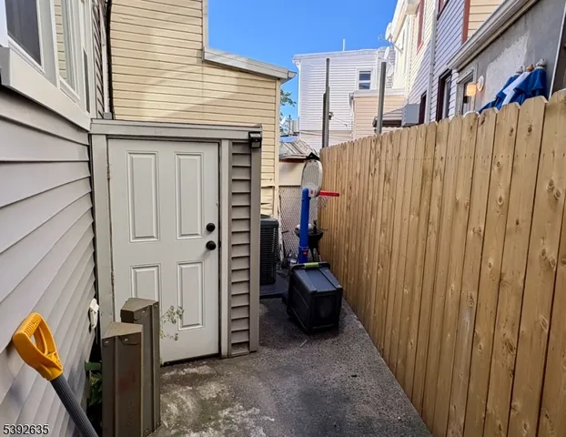 a view of a house with wooden fence