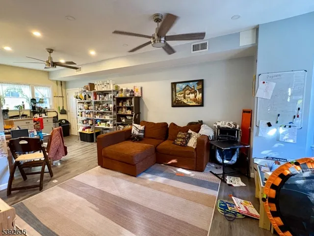a living room with lots of furniture and lots of furniture