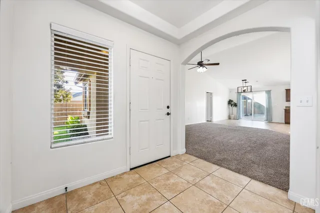 a view of an empty room and a window