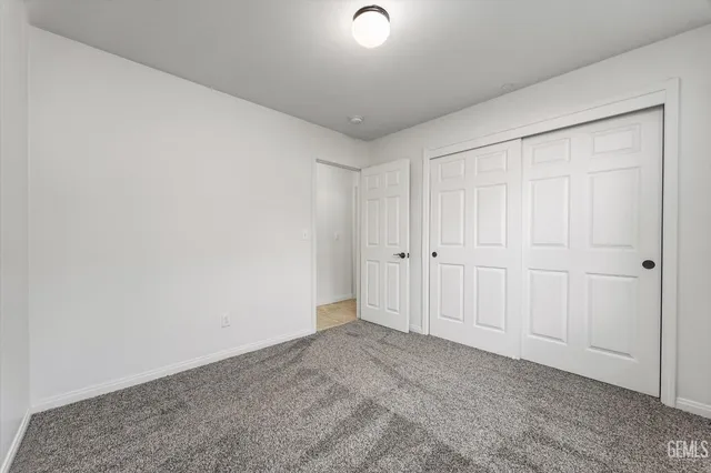 a view of a backyard with swimming pool