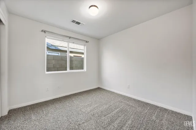 a view of an empty room with a balcony