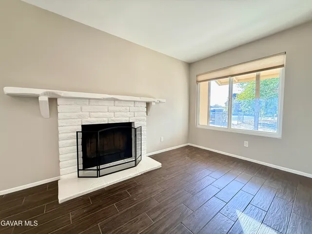 a living room with a fireplace