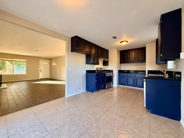 a large kitchen with wooden cabinets