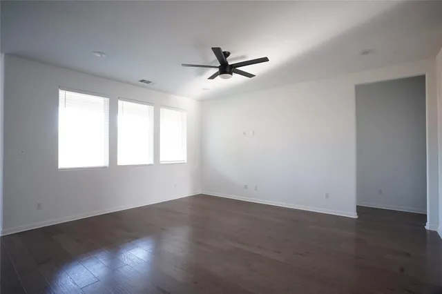 a view of kitchen with refrigerator microwave and stove