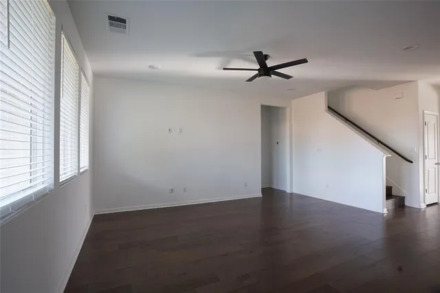 a kitchen with stainless steel appliances a refrigerator and a stove top oven
