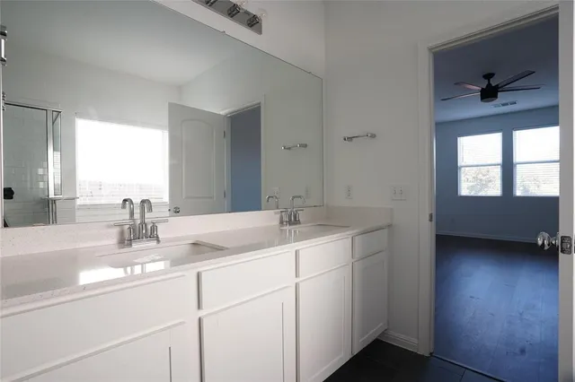 a view of a room with wooden floor and windows