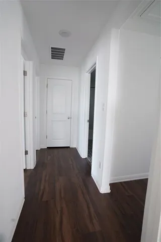a bathroom with a bathtub shower sink vanity and toilet