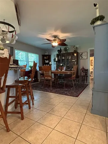 a room with a flat screen tv and a large window