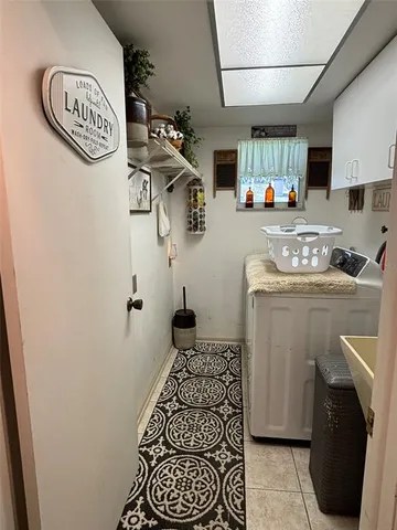 a backyard of a house with lots of green space and lake view