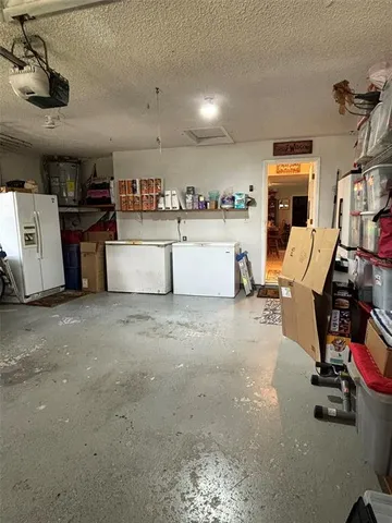 a view of an entrance to house with yard and green space