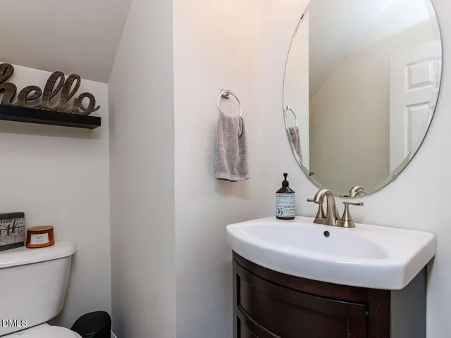 a kitchen with stainless steel appliances granite countertop a refrigerator a sink a stove top oven and a refrigerator