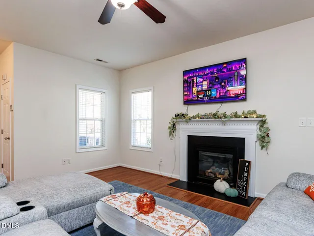 a view of a house with a small yard and plants
