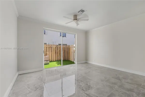 a view of an empty room with a window