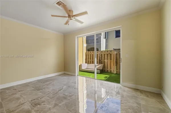 a view of an empty room with a window
