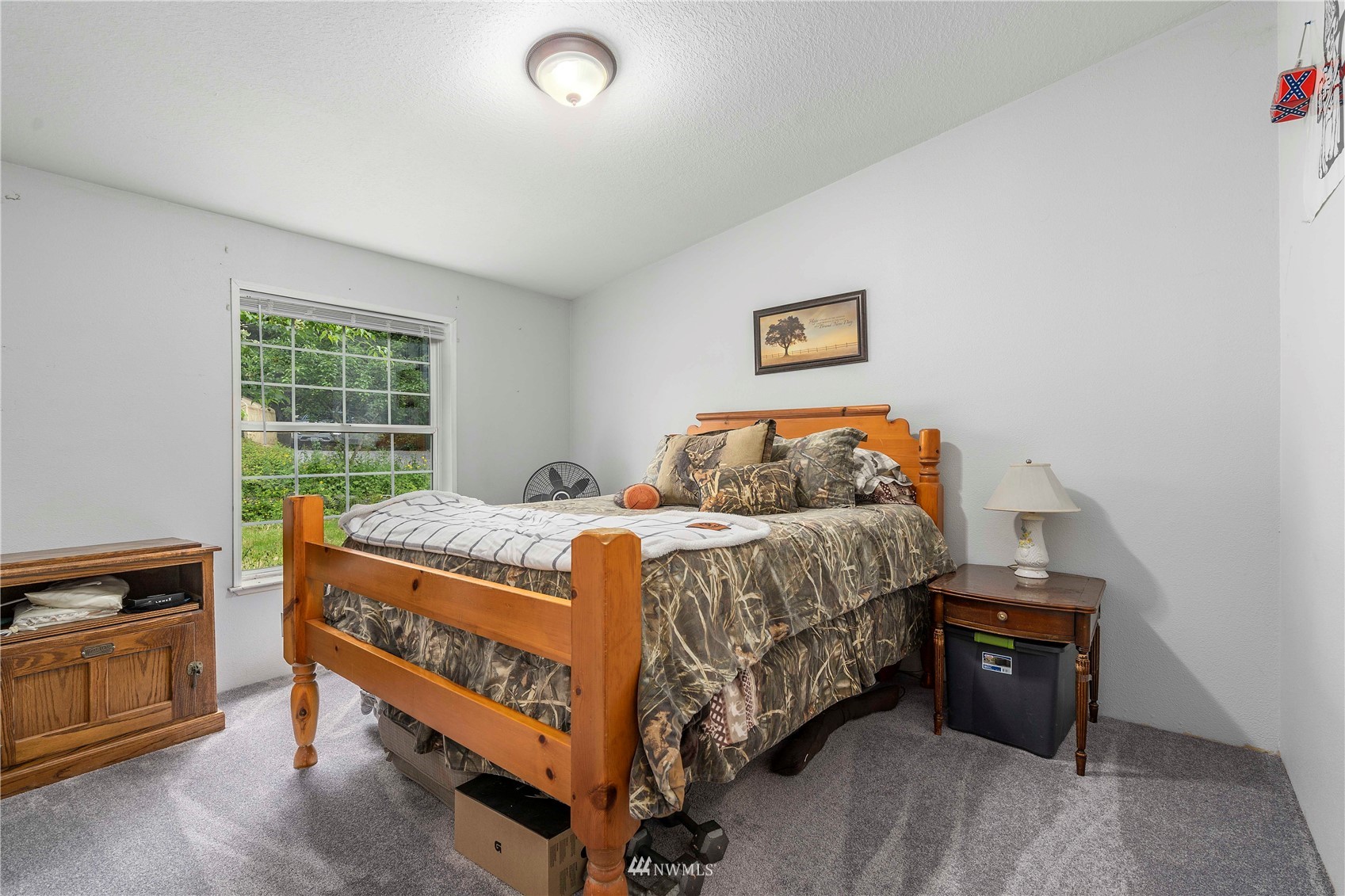 2721 South Lake Roesiger Road Snohomish, WA 98290 - Photo 19 of 26 a bed sitting in a bedroom next to a window