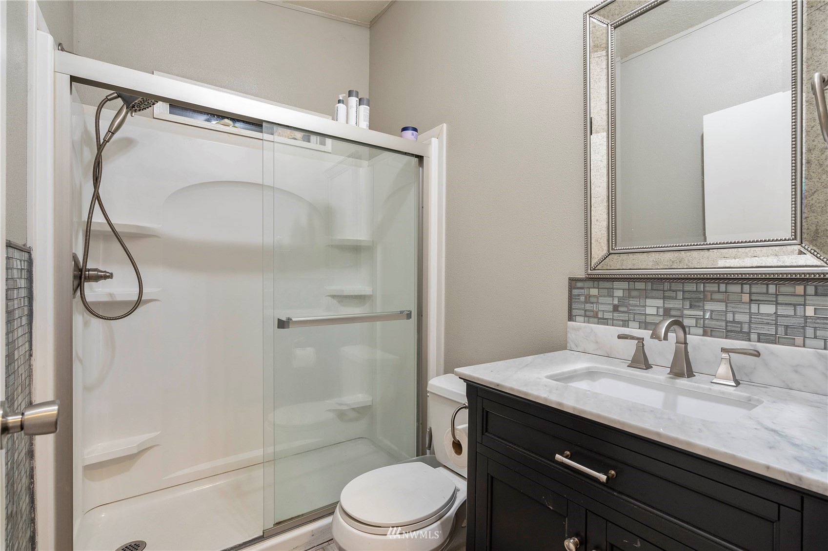 2721 South Lake Roesiger Road Snohomish, WA 98290 - Photo 21 of 26 a bathroom with a granite countertop sink toilet and shower