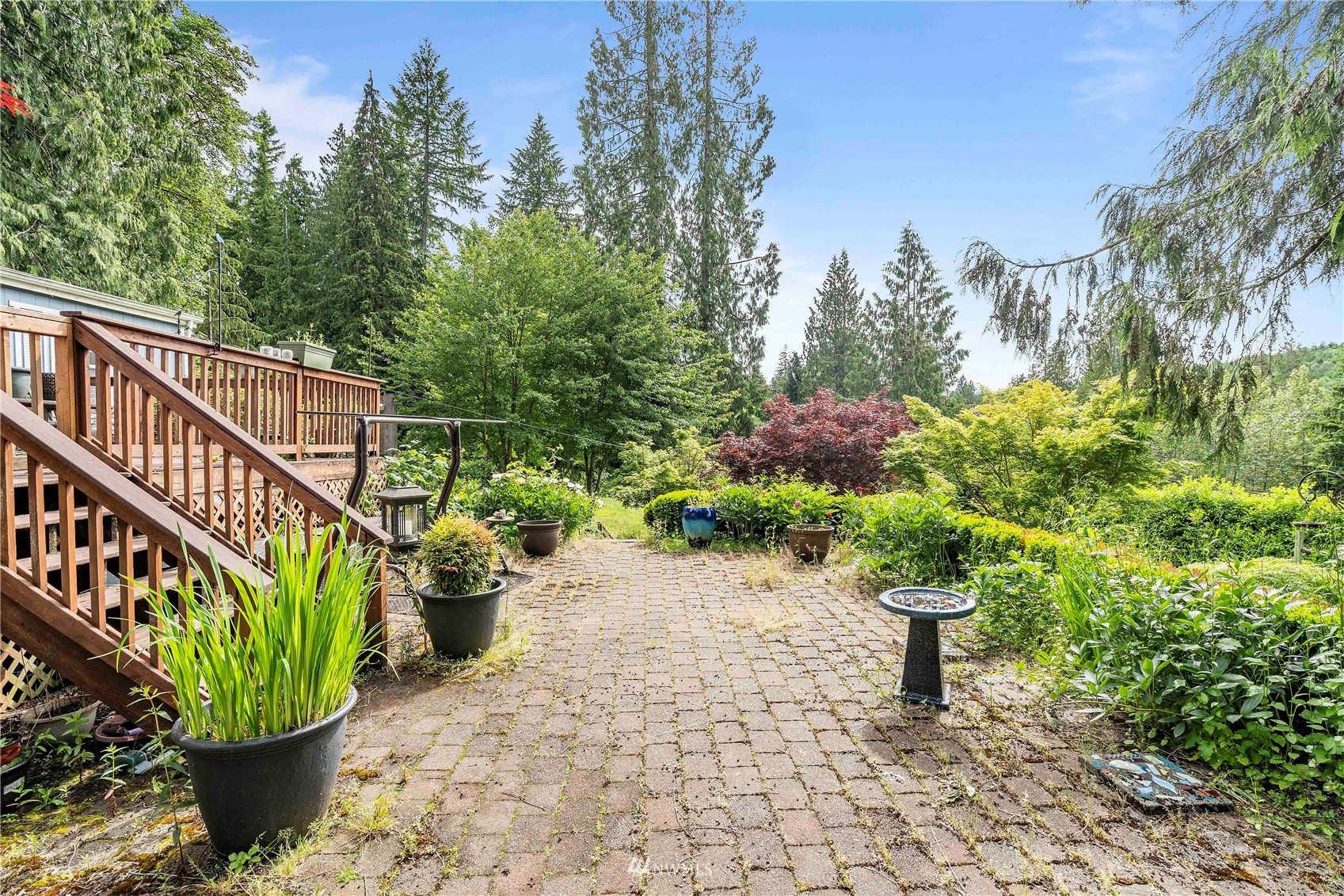 2721 South Lake Roesiger Road Snohomish, WA 98290 - Photo 6 of 26 a view of a chair with a potted plant