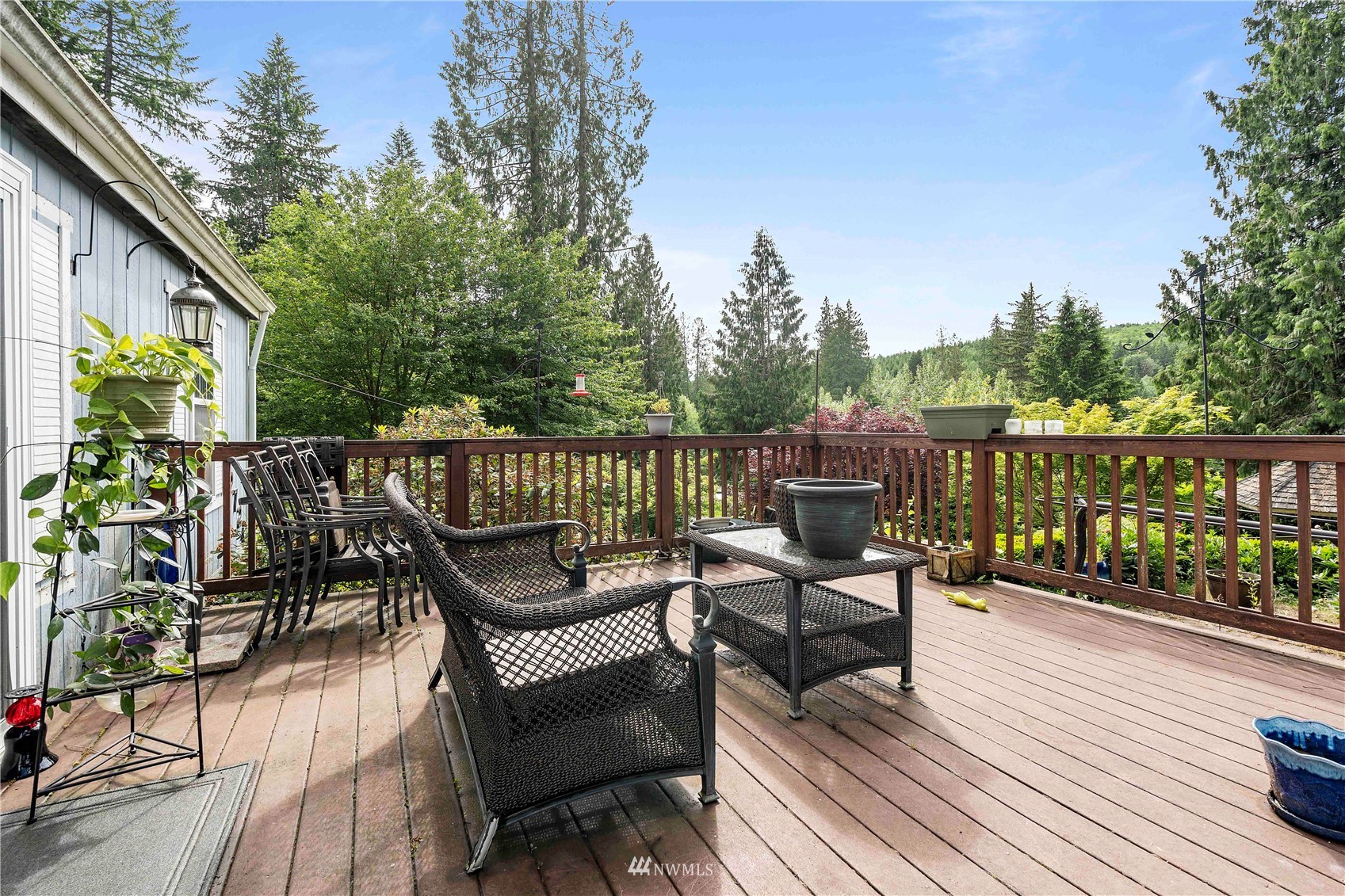 2721 South Lake Roesiger Road Snohomish, WA 98290 - Photo 7 of 26 a roof deck with wooden floor and fence