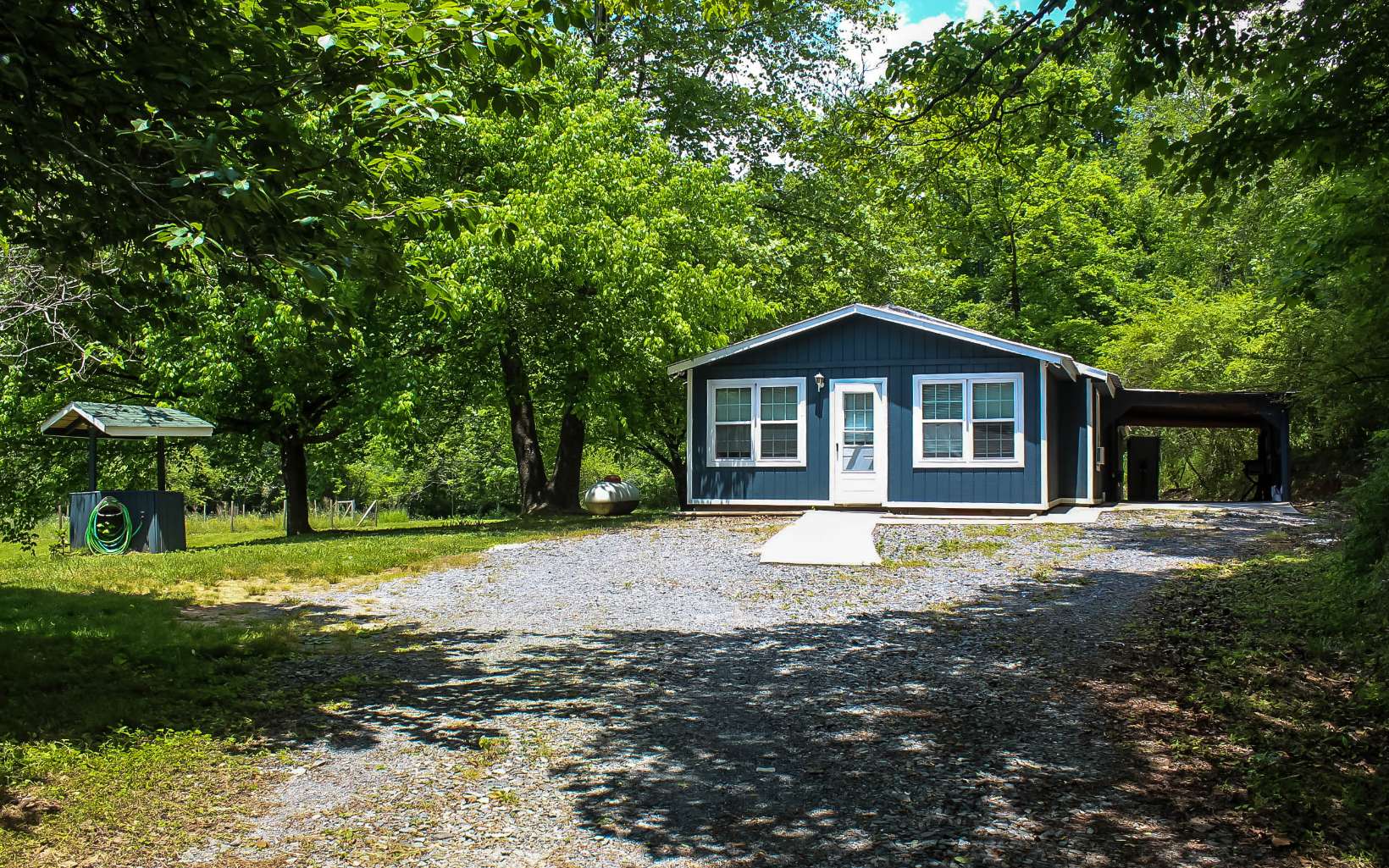 1466 Craigtown Road Ellijay, GA 30540 - Photo 2 of 4 a front view of a house with a yard
