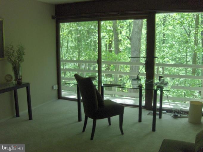 10704 Hunters Valley Road Vienna, VA 22181 - Photo 13 of 26 Bedroom with a wall of windows