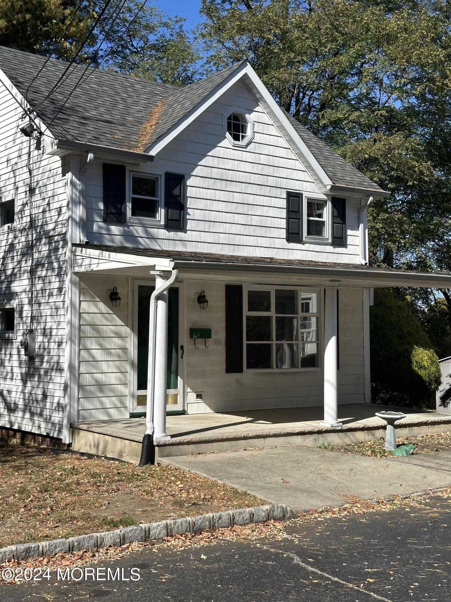 1 Leonardville Road, Unit C Middletown, NJ 07748 - Photo 2 of 12 a front view of a house with a garage