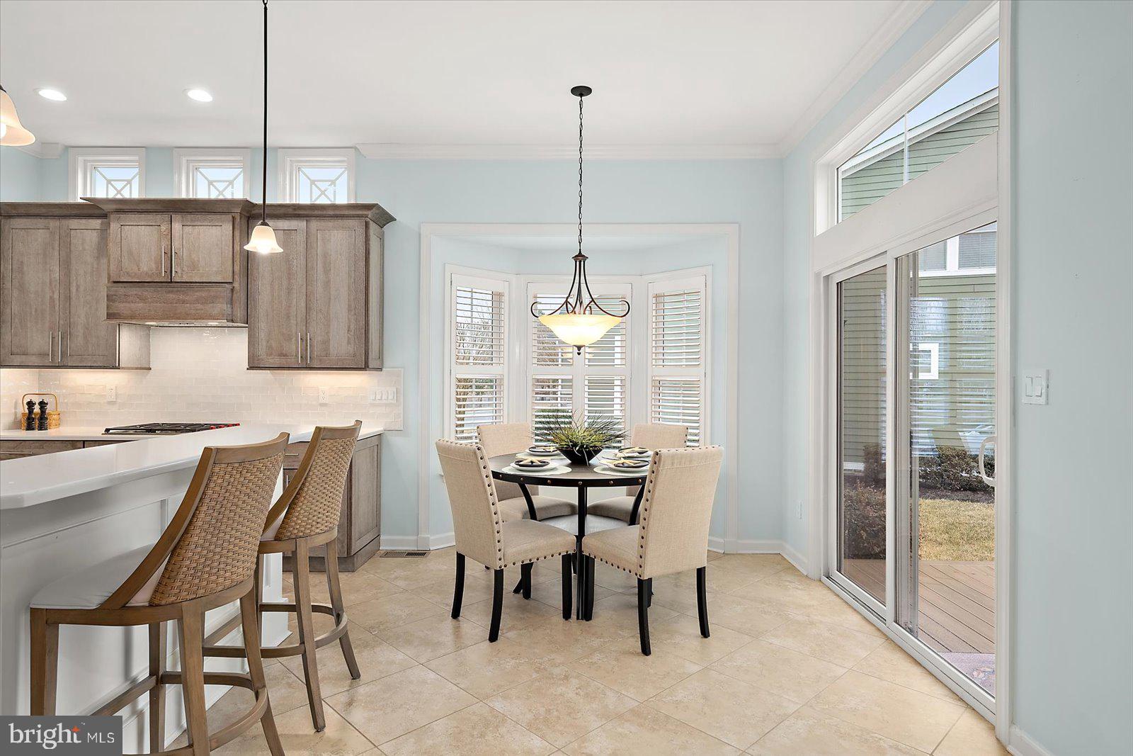 38896 Blue Indigo Road Selbyville, DE 19975 - Photo 26 of 86 a dining room with furniture and window