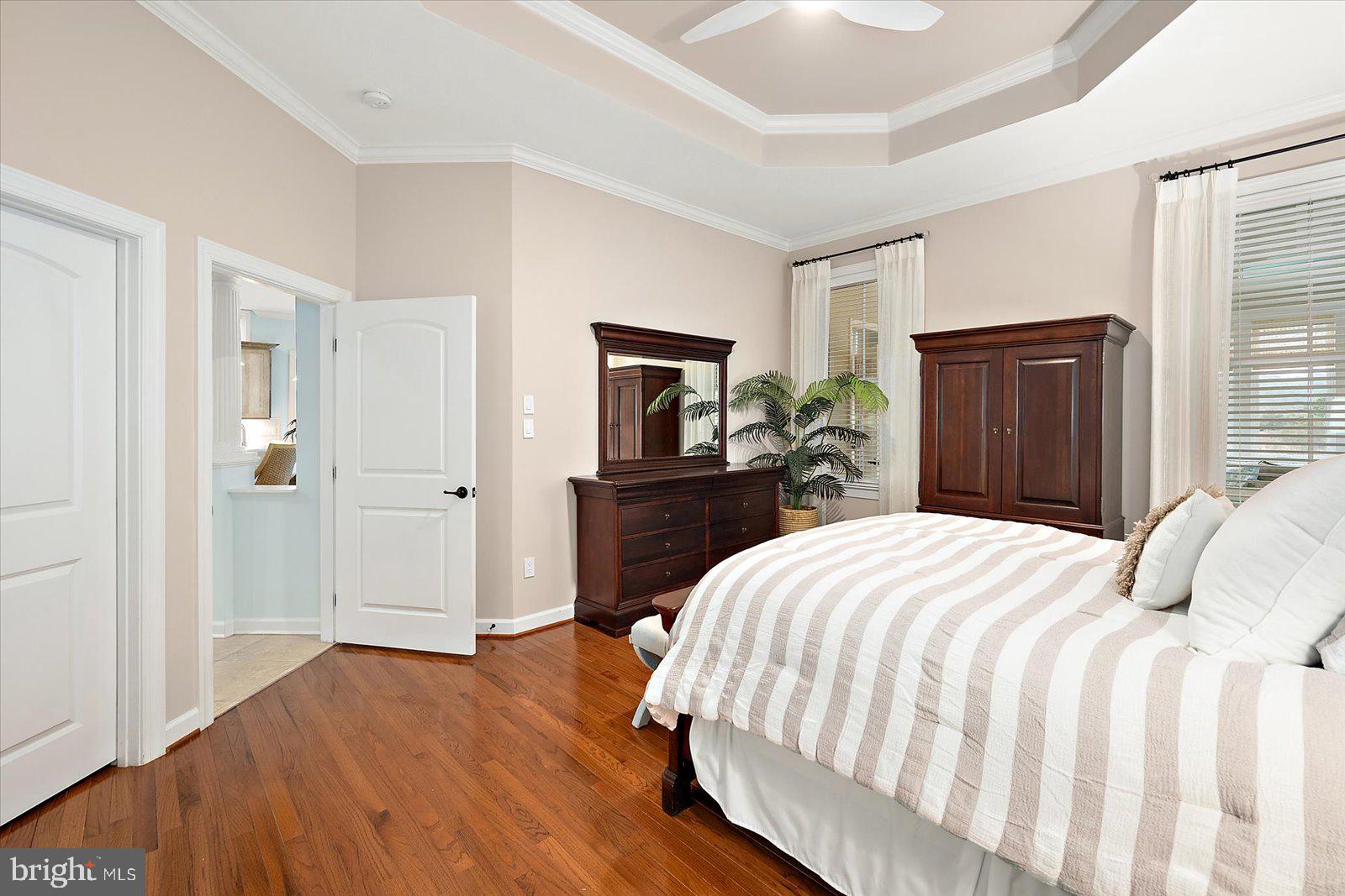 38896 Blue Indigo Road Selbyville, DE 19975 - Photo 40 of 86 a bedroom with a bed and a large mirror