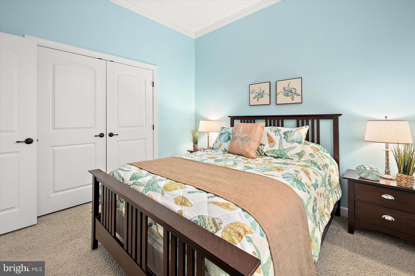 38896 Blue Indigo Road Selbyville, DE 19975 - Photo 45 of 86 a bedroom with a bed and a lamp on table
