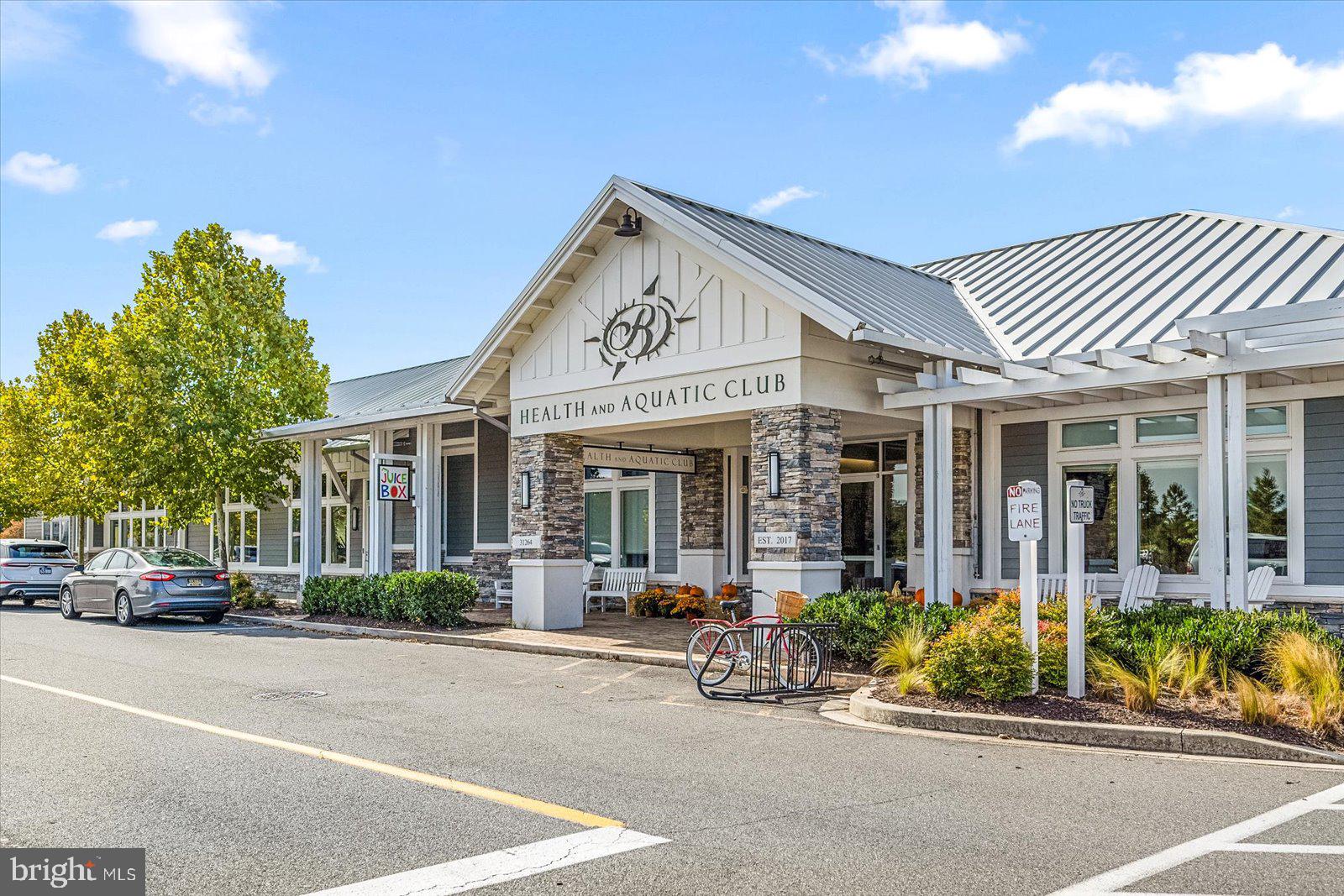 38896 Blue Indigo Road Selbyville, DE 19975 - Photo 64 of 86 a view of a car parked in front of a building