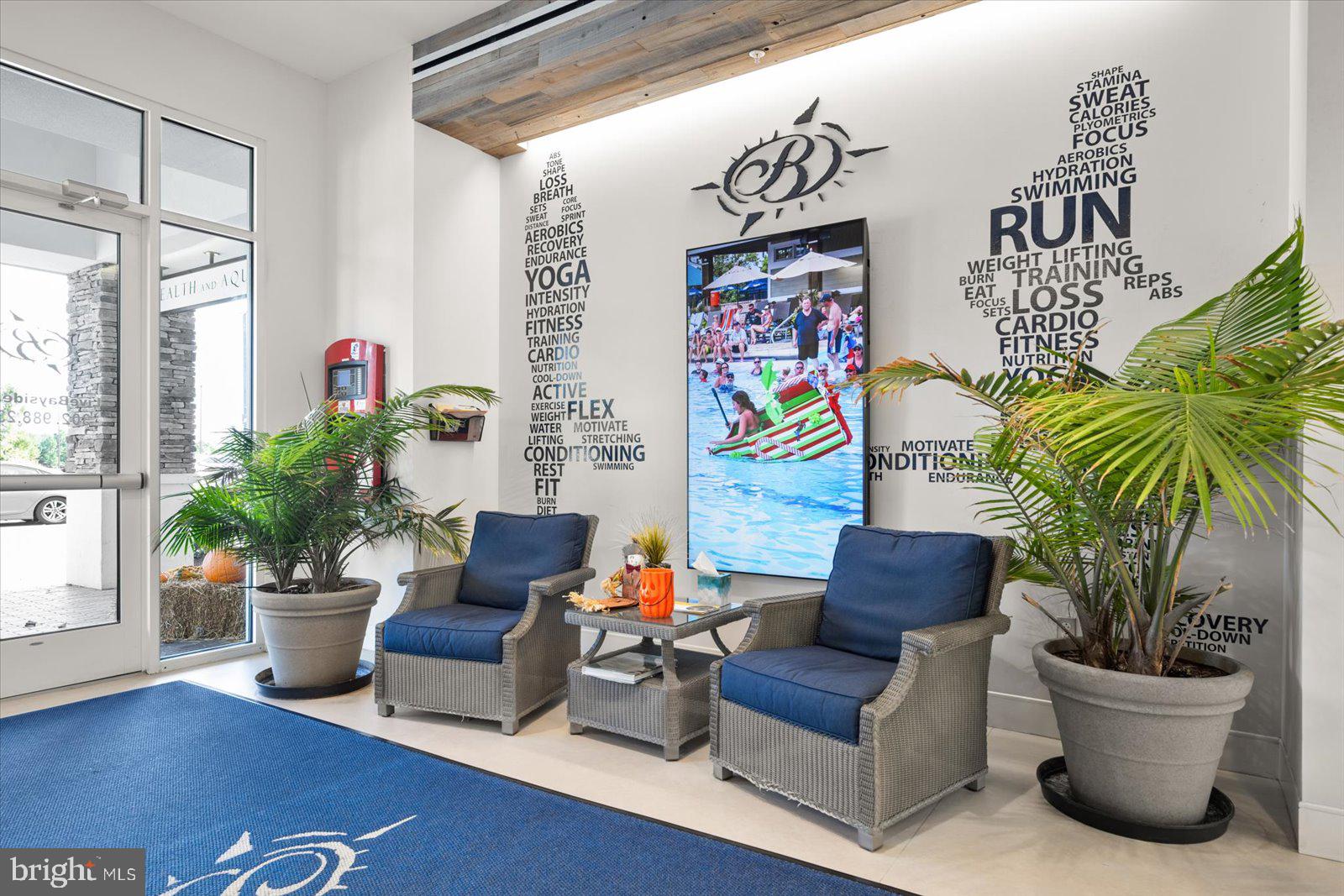 38896 Blue Indigo Road Selbyville, DE 19975 - Photo 65 of 86 a living room with furniture and a potted plant