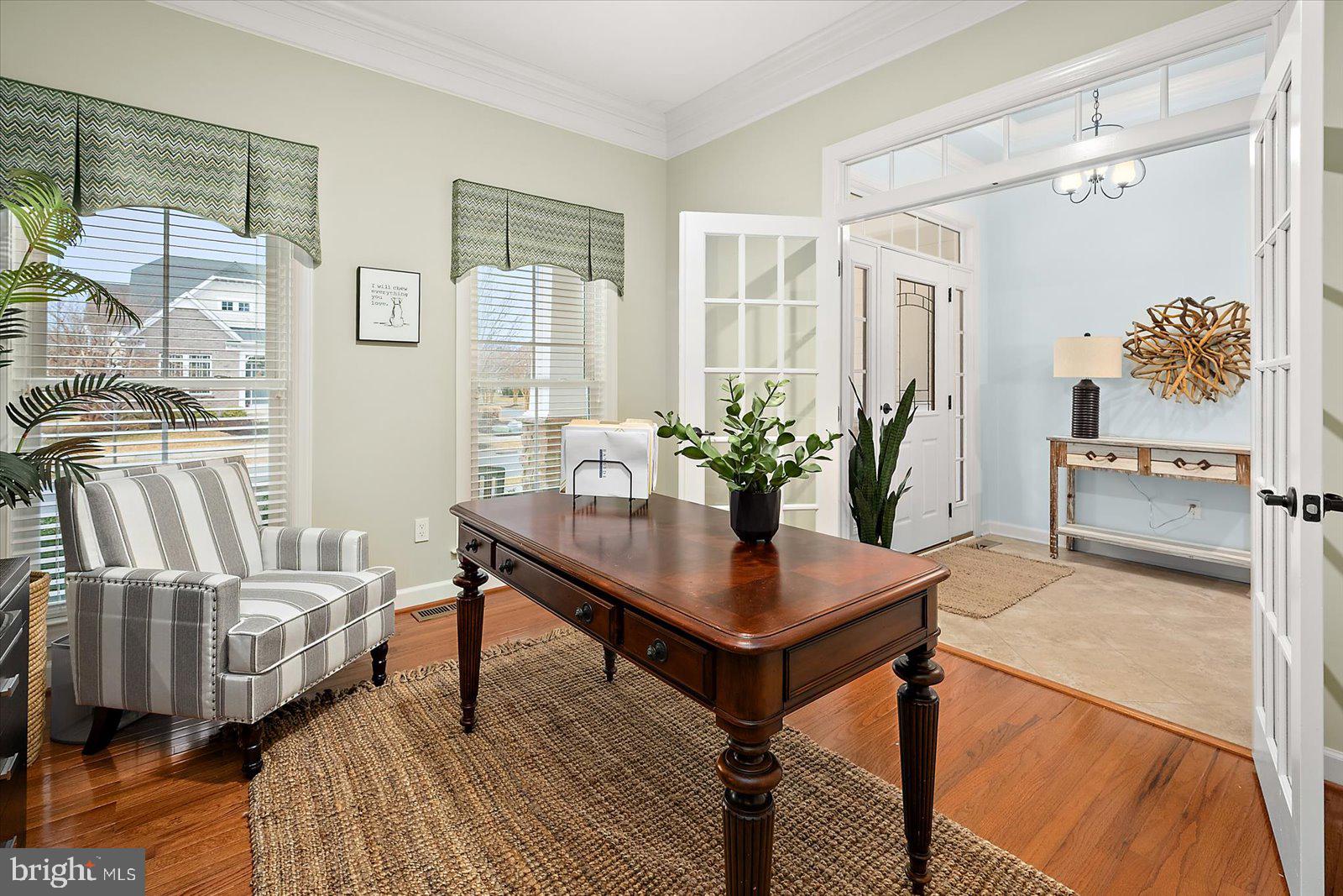 38896 Blue Indigo Road Selbyville, DE 19975 - Photo 10 of 86 a view of a livingroom with furniture and a potted plant