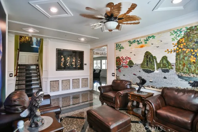 a living room with furniture fireplace and flat screen tv