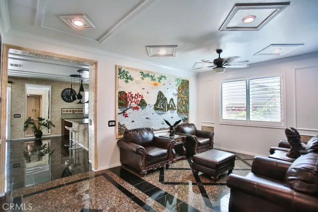 a very nice looking room with kitchen view and a large window