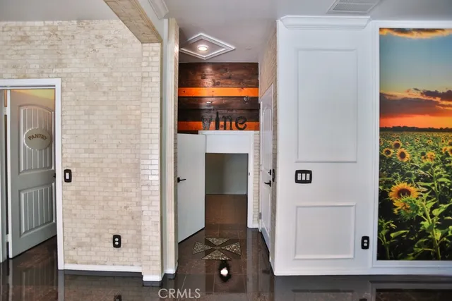 a bathroom with a tub a sink and a large window