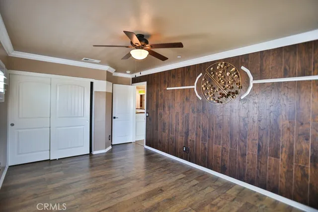a living room with window and a flat screen tv