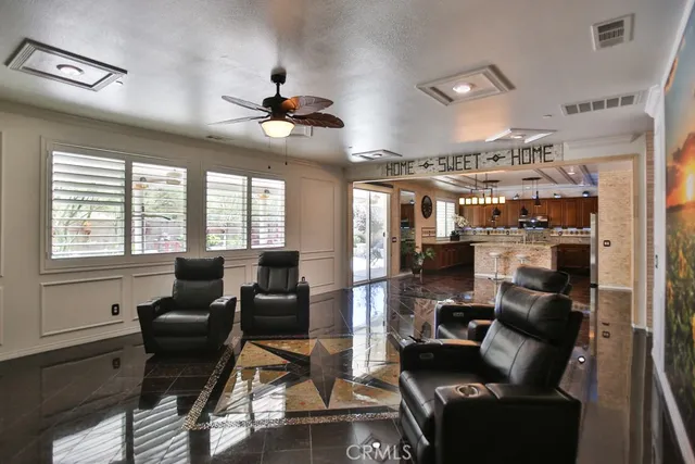 a view of a livingroom with furniture and a flat screen tv