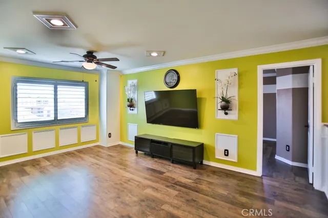 a view of a workspace with furniture and a potted plant