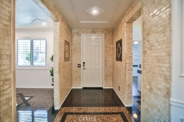 a living room with furniture a rug and a flat screen tv