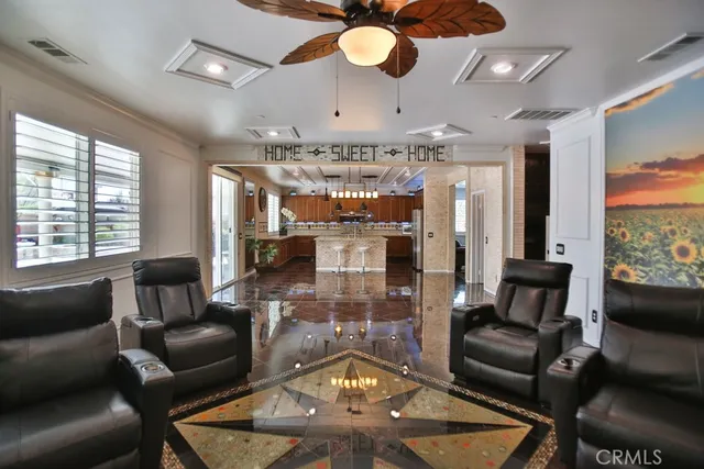 a bathroom with a granite countertop shower a sink and a mirror