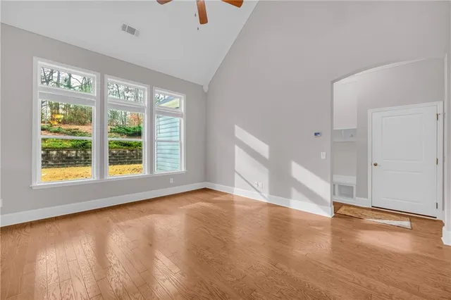 a kitchen with stainless steel appliances kitchen island granite countertop a table and chairs in it
