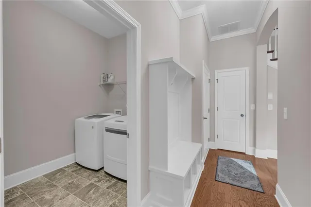 a view of an entryway with wooden floor