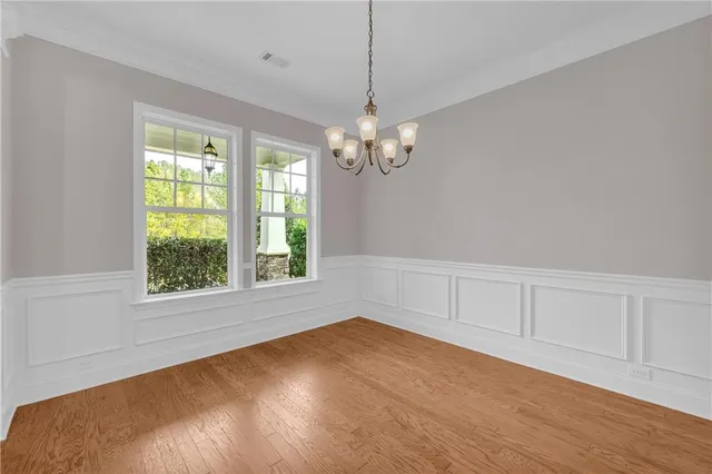a view of a workspace with lounge chair and a window