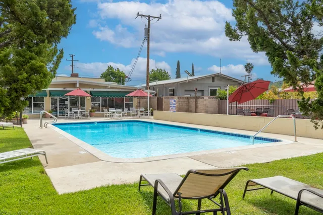 a view of swimming pool with a yard