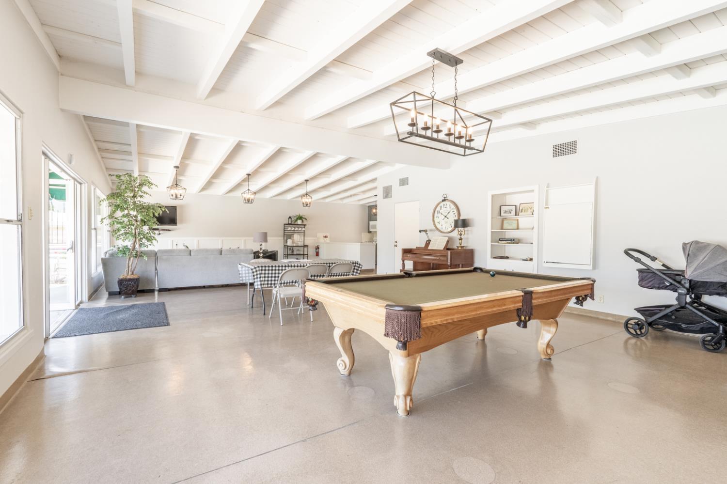 1075 Loma Drive, Unit 66 Ojai, CA 93023 - Photo 20 of 22 a room with lots of furniture and a chandelier